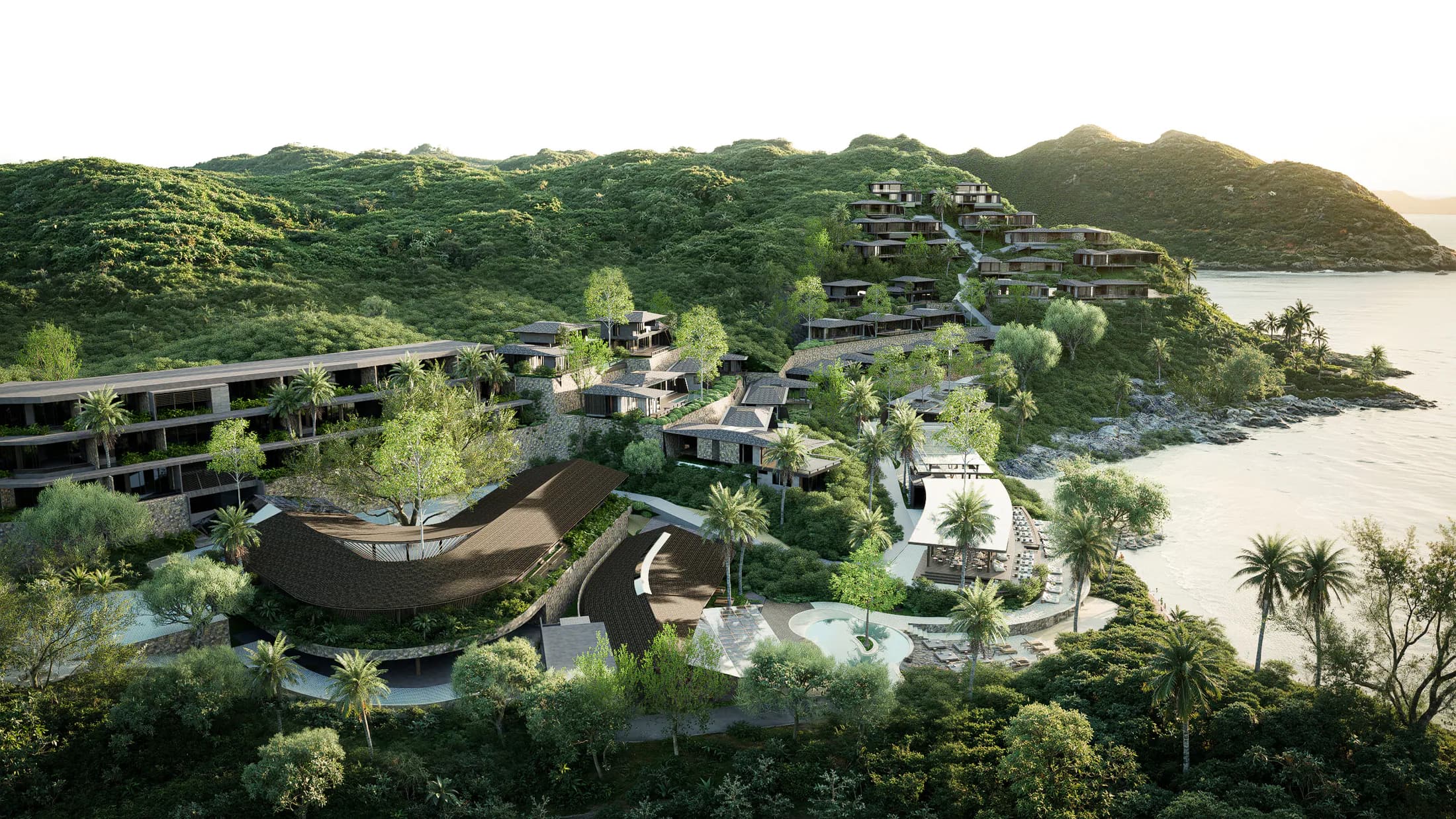 Terrassen van de AURAH villa's tussen tropisch groen met uitzicht op de kust van Zuid-Lombok.