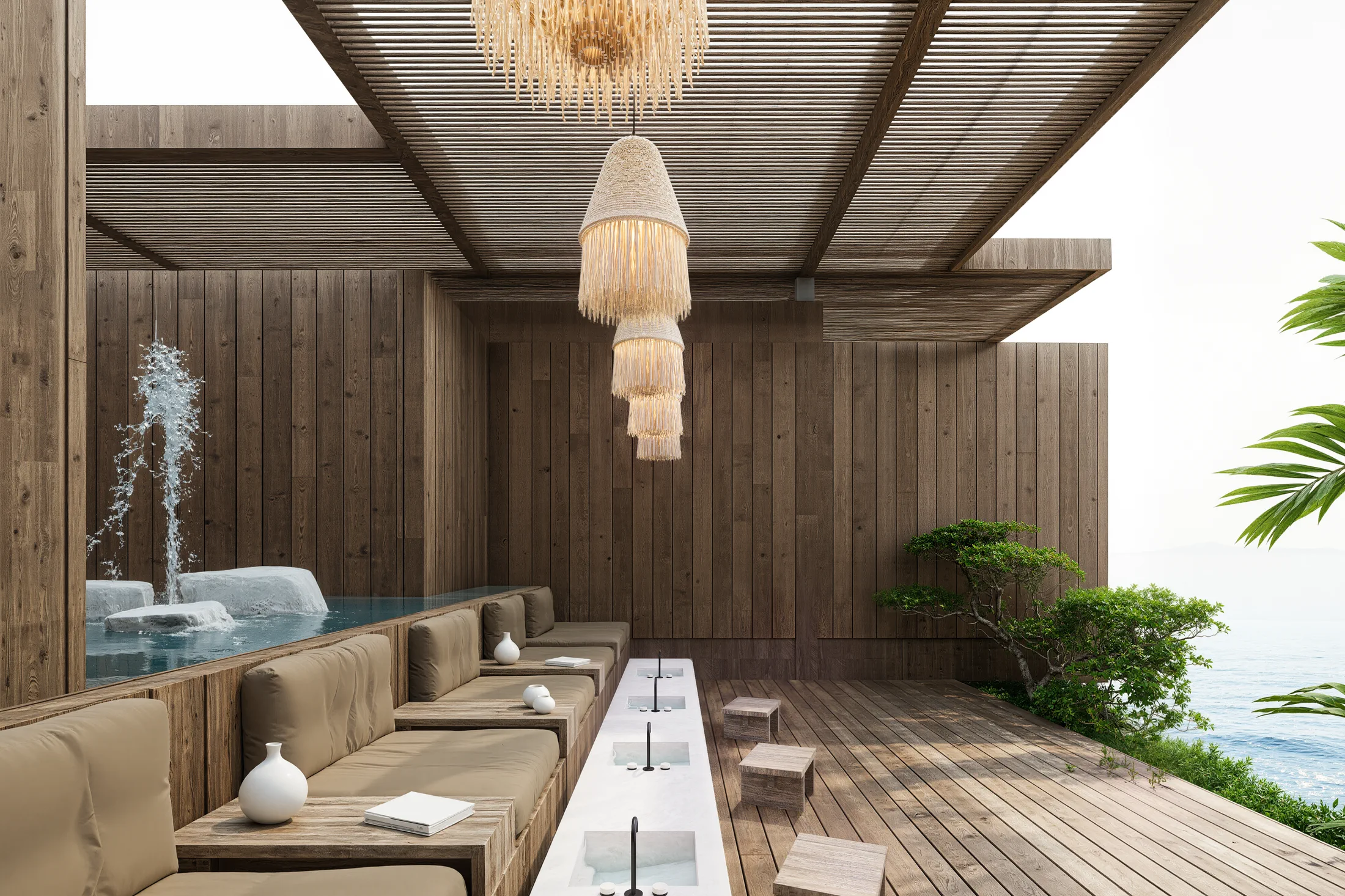 Spa lounge van AURAH met ingebouwde banken, zachte kussens en een beschutte waterpartij.