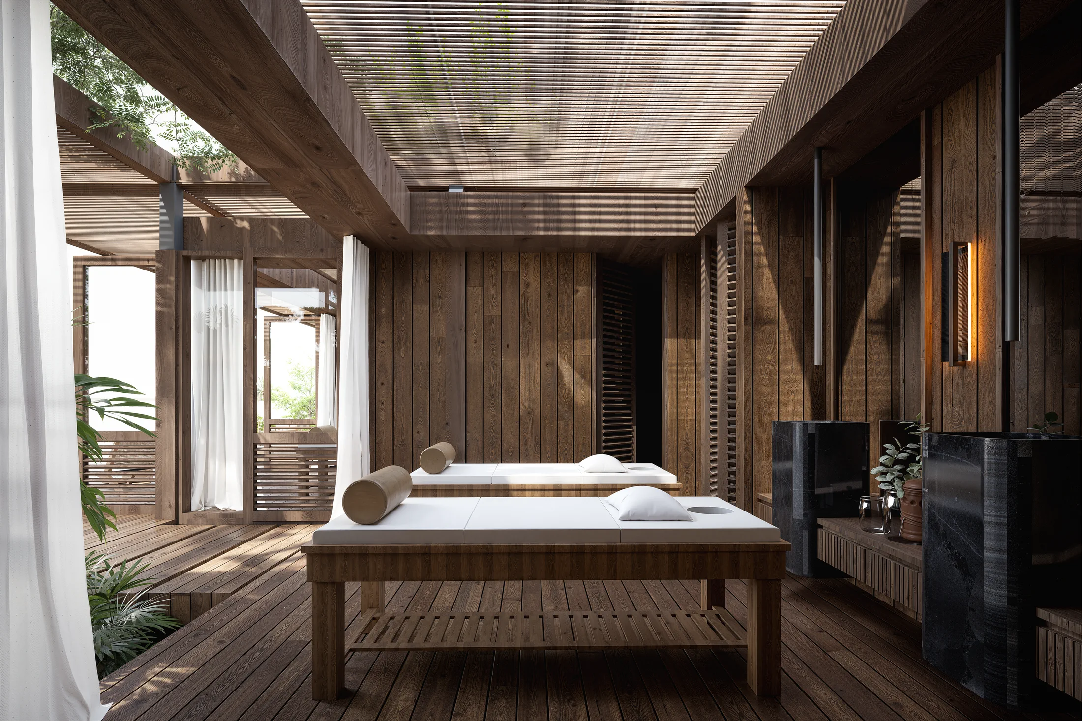Privécabana van de AURAH spa met massagetafel, houten vloer en gordijnen voor extra rust.