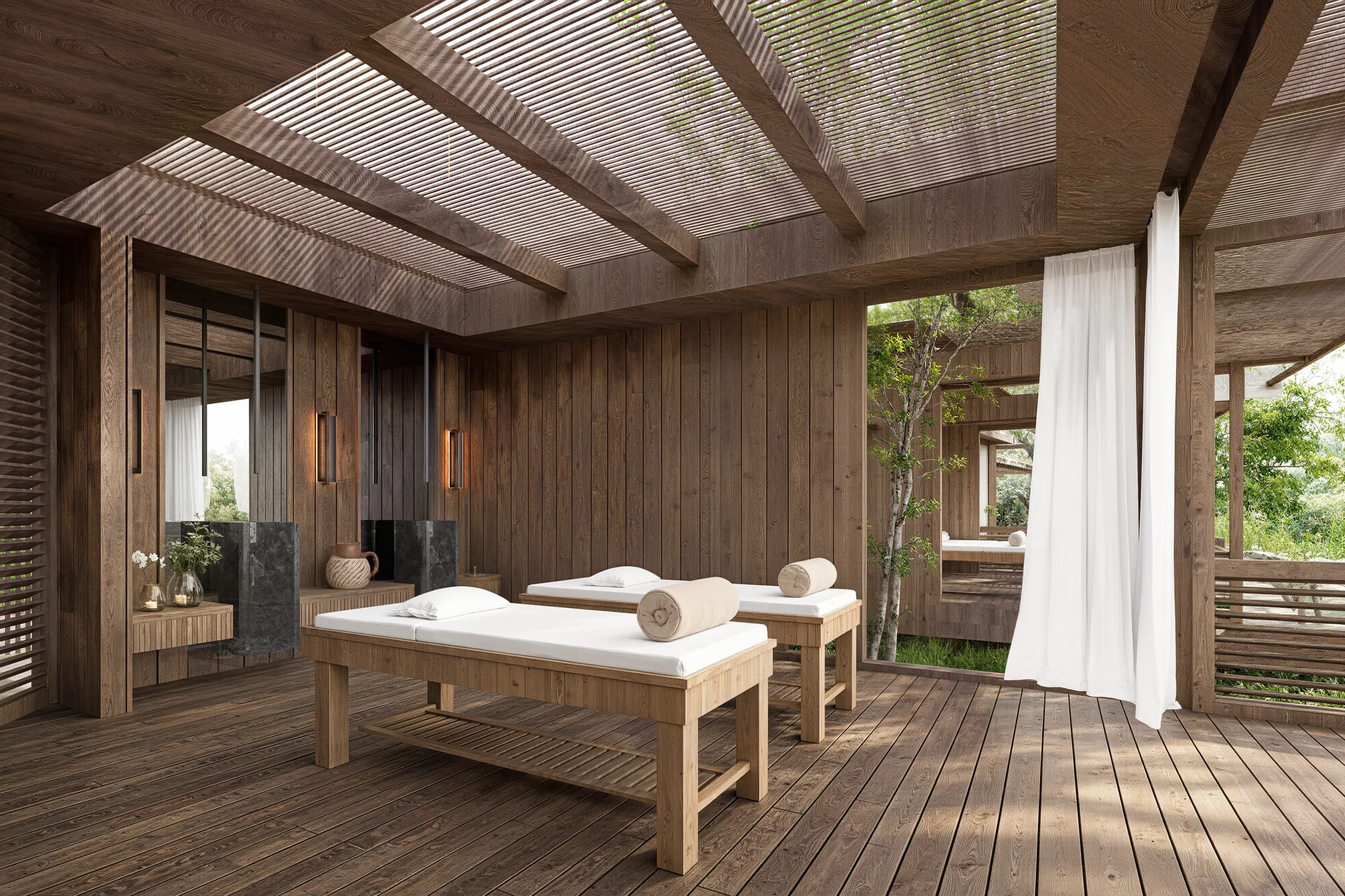 Massageruimte van de AURAH spa met twee behandeltafels en open uitzicht richting de oceaan.